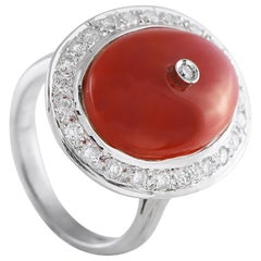 Anello in oro bianco 18 carati con diamante e corallo da 0,65 carati