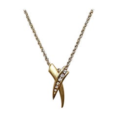 Ciondolo d'amore a scorrimento con diamante in oro giallo 14k da 0,16 carati e catena in oro 14k da 18".