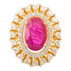 Luxury Wedding Ring in 14k Yellow Gold with Oval Cut Ruby and Halo Diamond