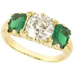 Classic English Emerald Diamond Gold Three-Stone Engagement Ring