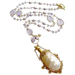 Ametrine, collier bouteille parfum en améthyste et coquillages de Chatelaine en tranches