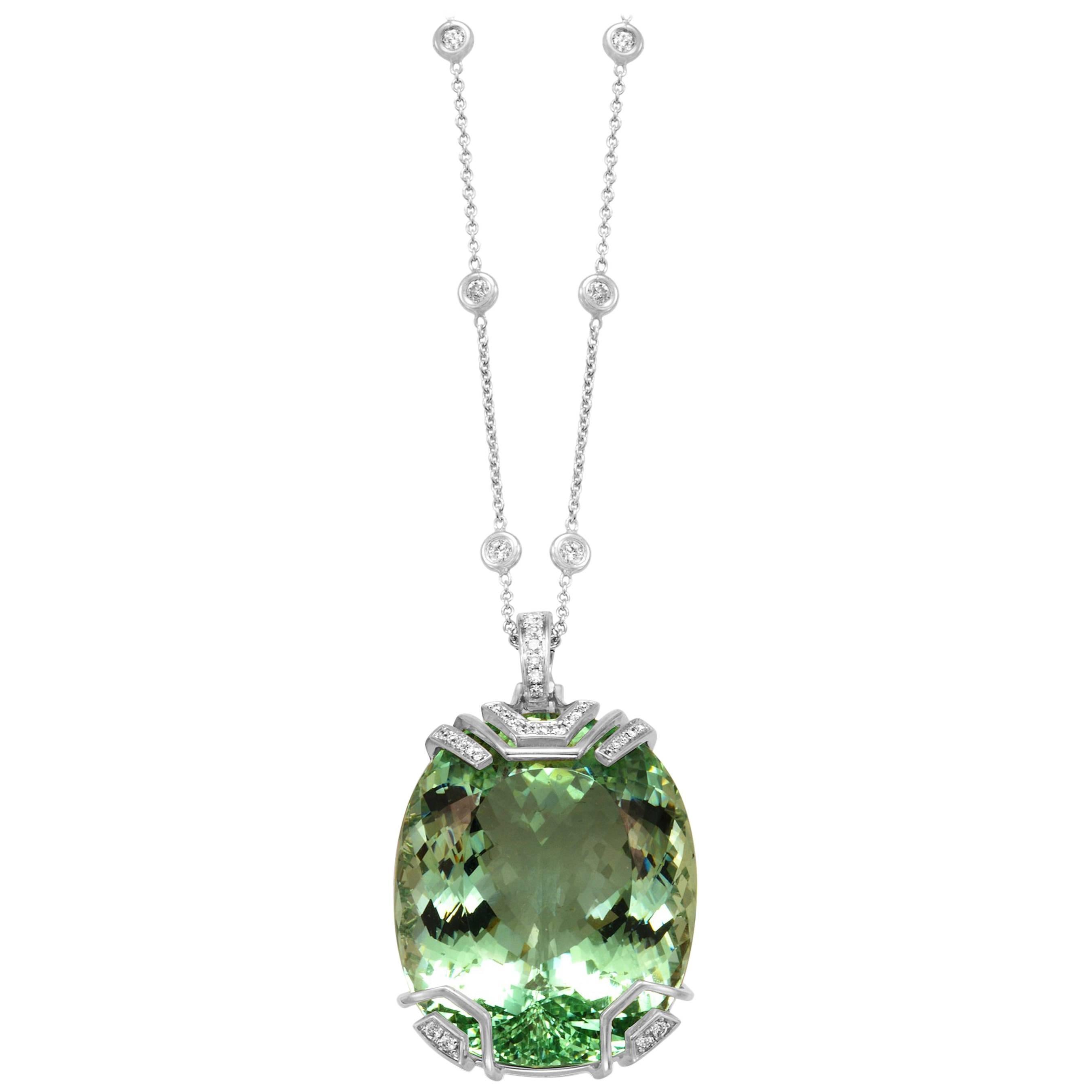 One-of-a-kind Frederic Sage oval cabochon Green Beryl pendant with diamond accents and diamond bale with 18 inch diamond-accented chain (included) set in 18 karat white gold

Total Green Beryl weight: 76.83 ct
Total diamond count: 30
Total diamond