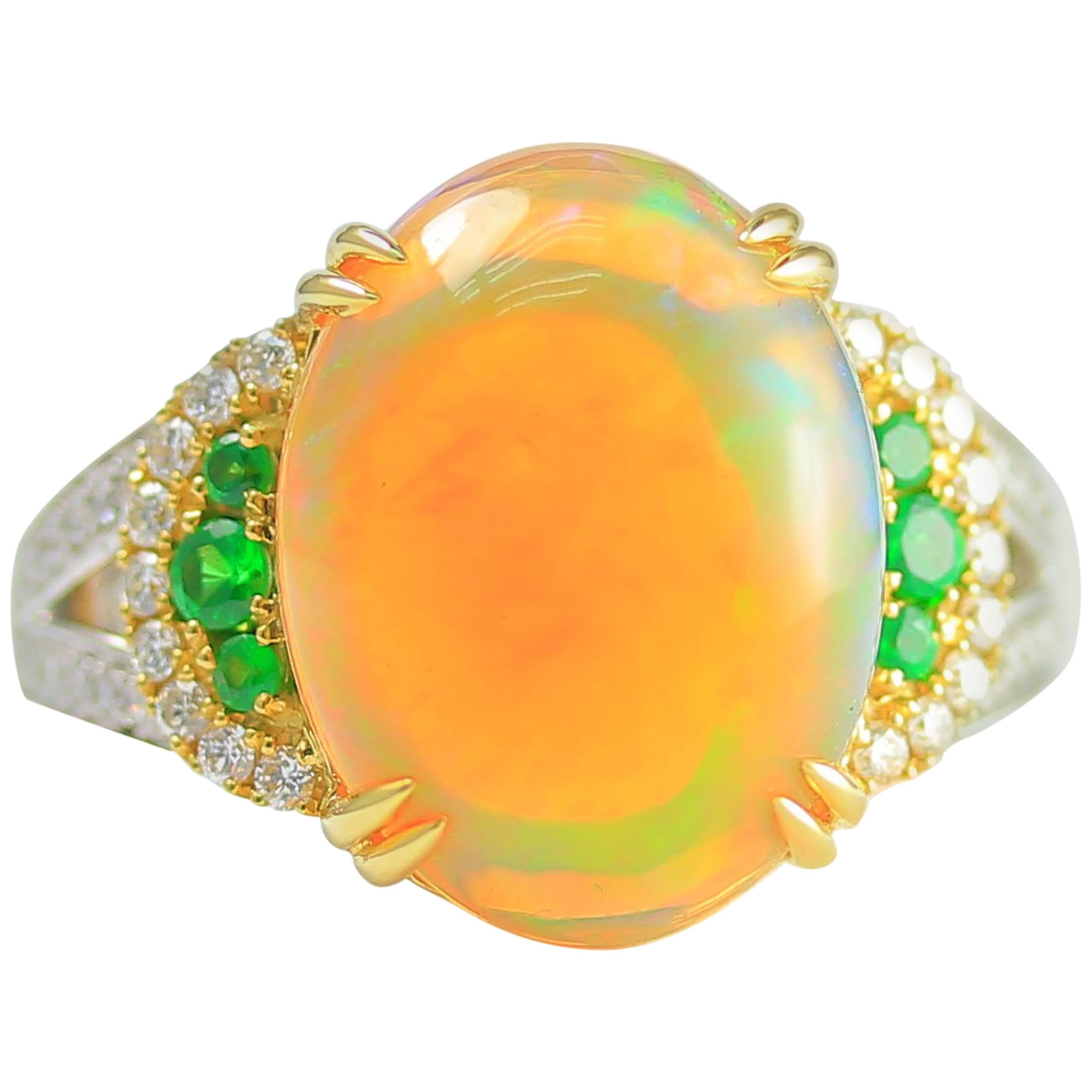 Frederic Sage 18k YWG One of Kine Opal, Tsavorite and Diamond Ring adorned beautiful diamonds, set in 18K Yellow and White Gold. 

Opal Weight: 5.95 carats
Tsavorite Count: 6 
Tsavorite Weight: 0.18 carats
Diamond Count: 46
Diamond Weight: 0.33 CT