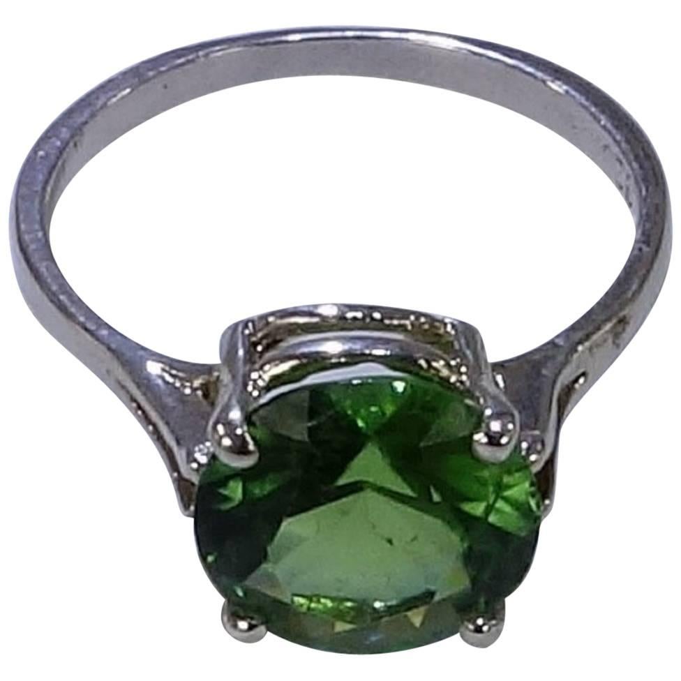 Sterling Silver Basket Style Setting holding Round Apple Green 10mm Tourmaline of 3.24 ct. Green is THE Color for 2017. And, this Tourmaline is THE Green to wear! Ring size is 8.5