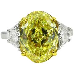 Stunning GIA Certified 4.61 Carat Fancy Intense Yellow Oval Diamond Ring