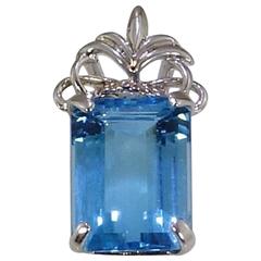 Brilliant Emerald Cut Sky Blue Topaz Set in Ornate Sterling Silver Pendant