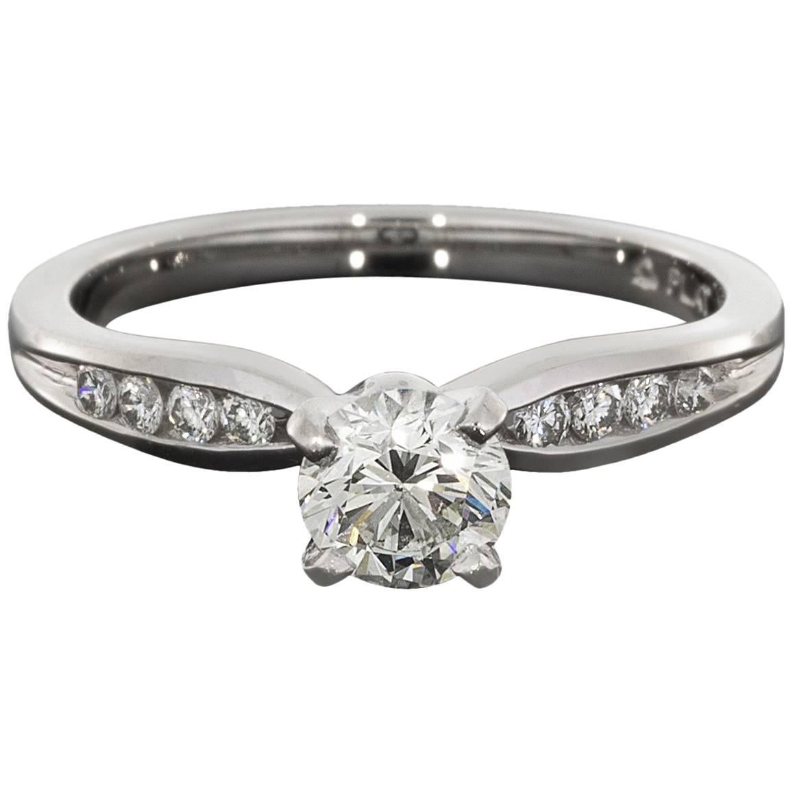 Round Diamond Platinum Pinch Channel Engagement Ring