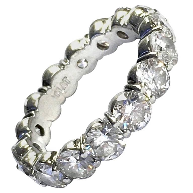 Platinum eternity band set with 16 round brilliant cut diamonds, approximate total weight of 3.85 carats, Color: G-H, Clarity: VS1-VS2
Weight: 5.1 grams
Size: 6 ((Sizing not recommended)