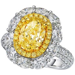 GIA Certified Fancy Yellow 2.11 Carat Oval Cut Diamond Engagement Ring