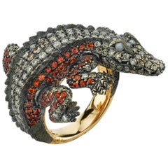 Alligator-Ring aus Gold mit Katzenaugen-Diamant und Saphir