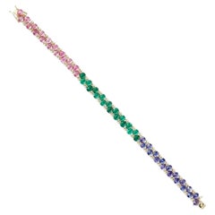 Tennisarmband aus 18-karätigem Gold mit natürlichen Smaragden, rosa Saphiren, Tansaniten und Diamanten