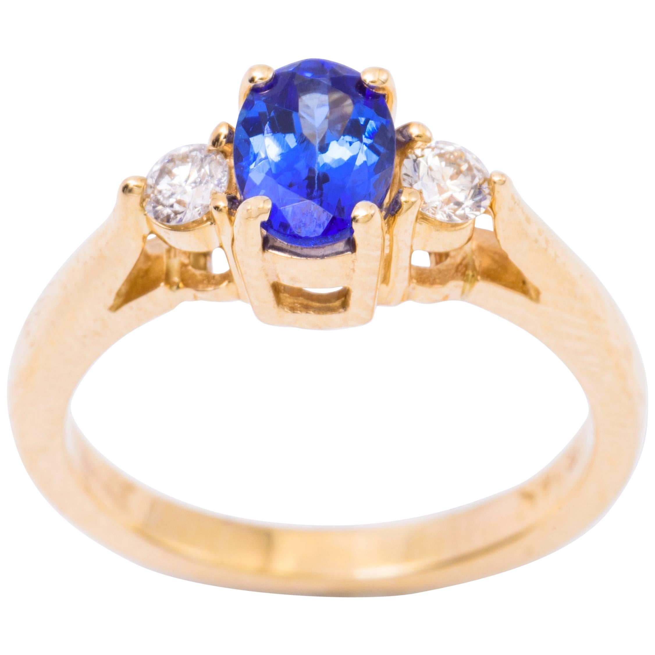 Oval Tanzanite Diamond Gold Three-Stone Engagement Ring