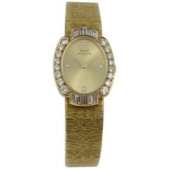 Piaget Ladies Yellow Gold Diamond Dial Diamond Bezel Wristwatch 9