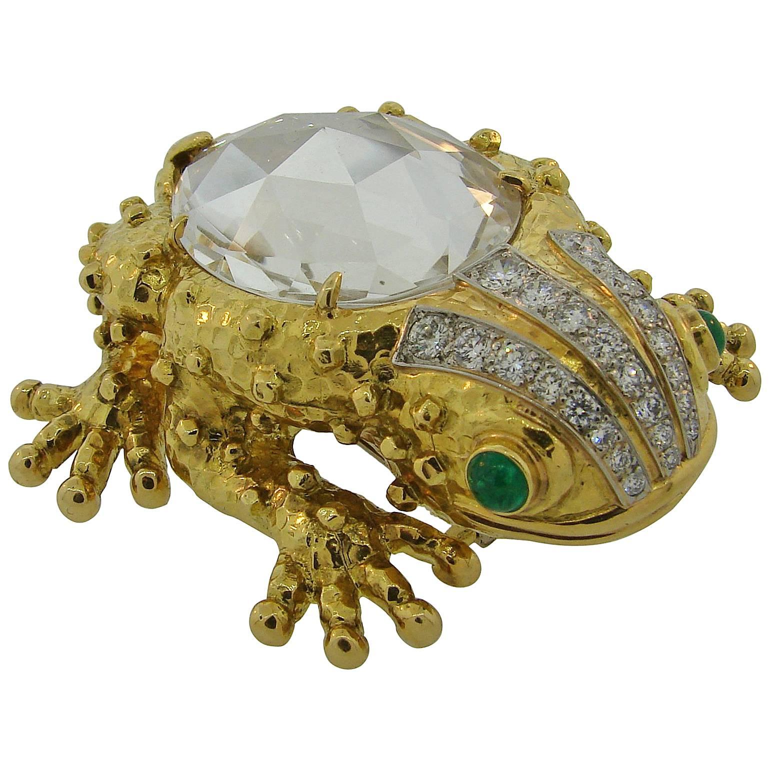 Signature David Webb frog clip created in the 1980's. Bold and extravagant, the brooch is a great addition to your jewelry collection and will accentuate your fun-loving personality. 
It features a large rose cut pear-shape rock crystal set in 18