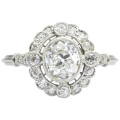 Edwardian Platinum Old Mine Cut Diamond Halo Engagement Ring, circa 1910