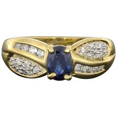 Oval Blue Sapphire Diamond Yellow Gold Bypass Ring