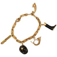1950s Hermes Paris Equestrian Five-Charm Black Enamel Gold Bracelet