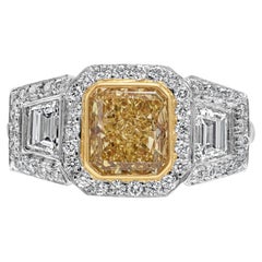 GIA Certified Fancy Intense Yellow Three-Stone Halo Engagement Ring