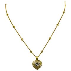 Classic Heart Shaped Diamond Gold Pendant with Baguette Diamond Accents