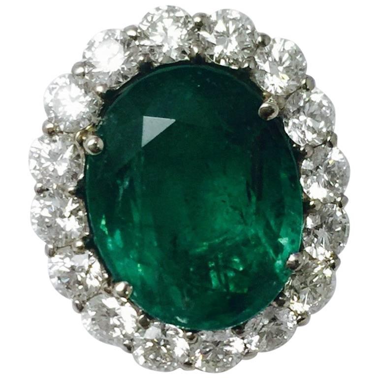 Captivating Colombian Emerald White Gold Framed by White Diamonds For Sale
