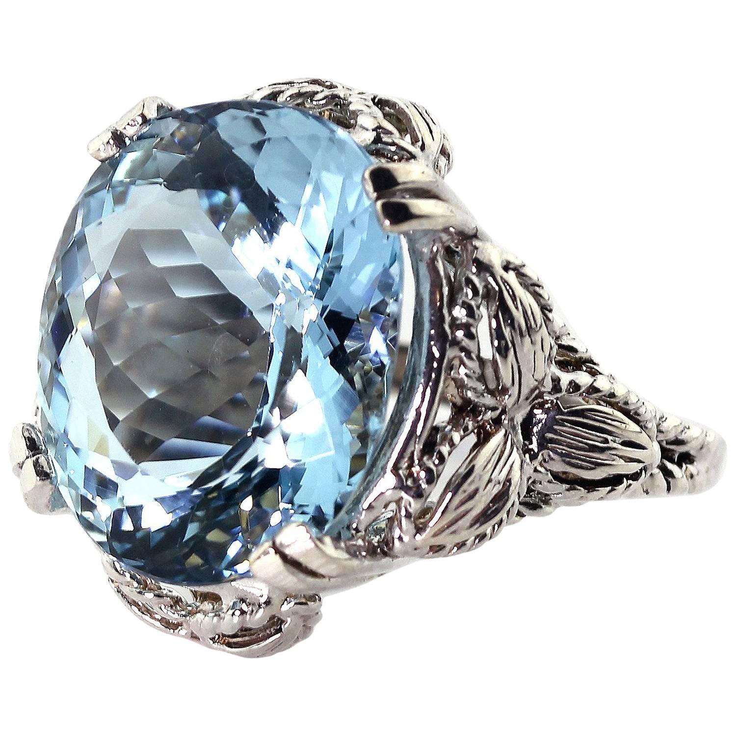 Natural sparkling happy blue flawless unique translucent Aquamarine. The flashes of natural sparkling blue in this exquisite 13.5 Carat oval superbly enhance its beauty set in this lovely handmade sterling silver ring.  This Aquamarine comes from