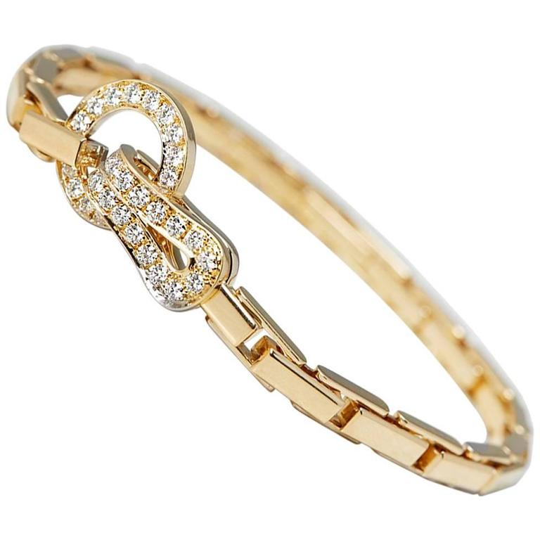 Cartier Diamond Yellow Gold Agrafe Bracelet at 1stDibs