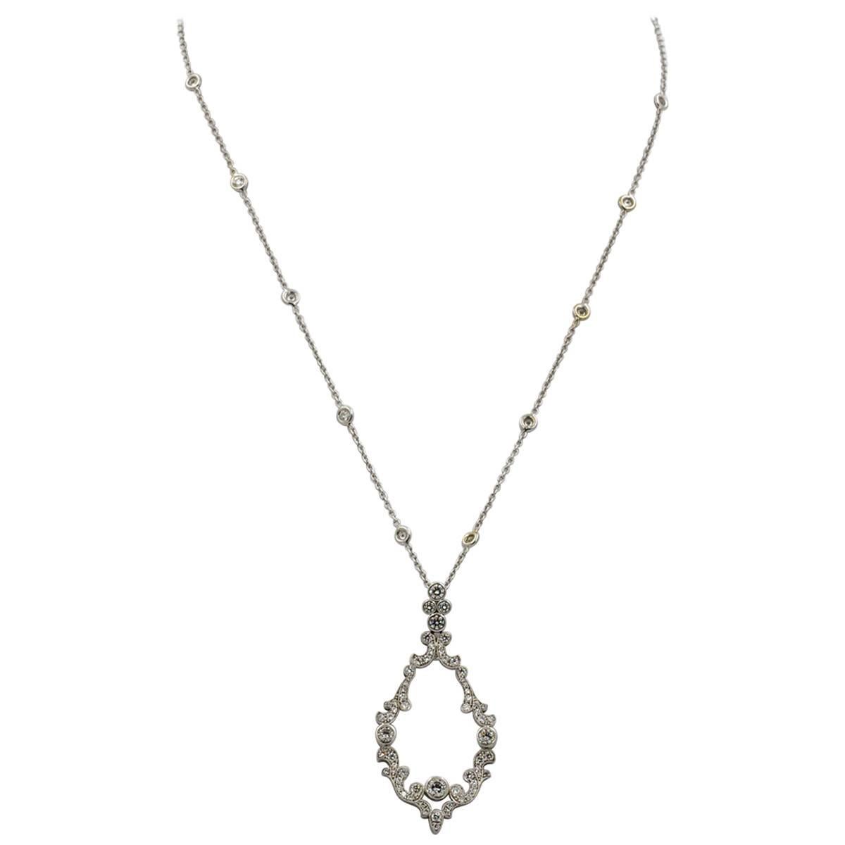 3.06 Carats Diamonds, Platinum Scroll Pendant