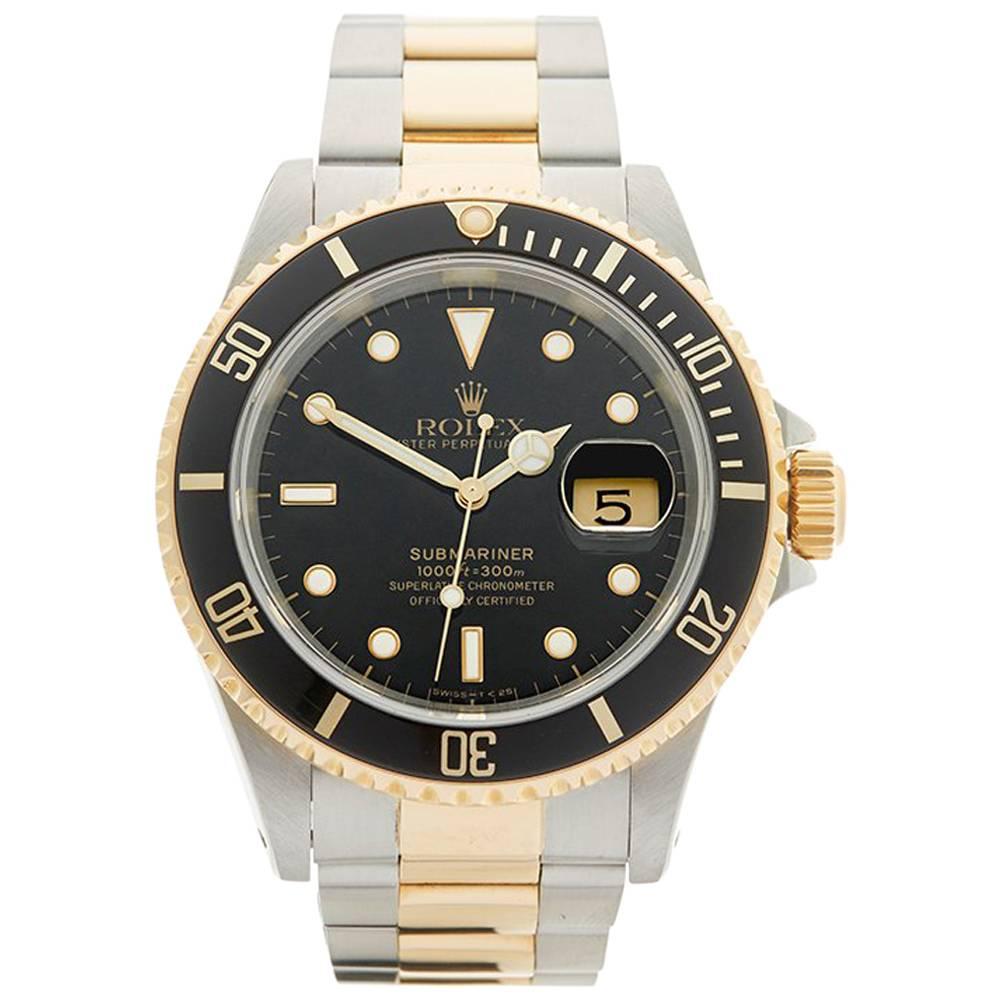 Rolex Submariner Stainless Steel and 18 Karat Yellow Gold Gents16613, 1989