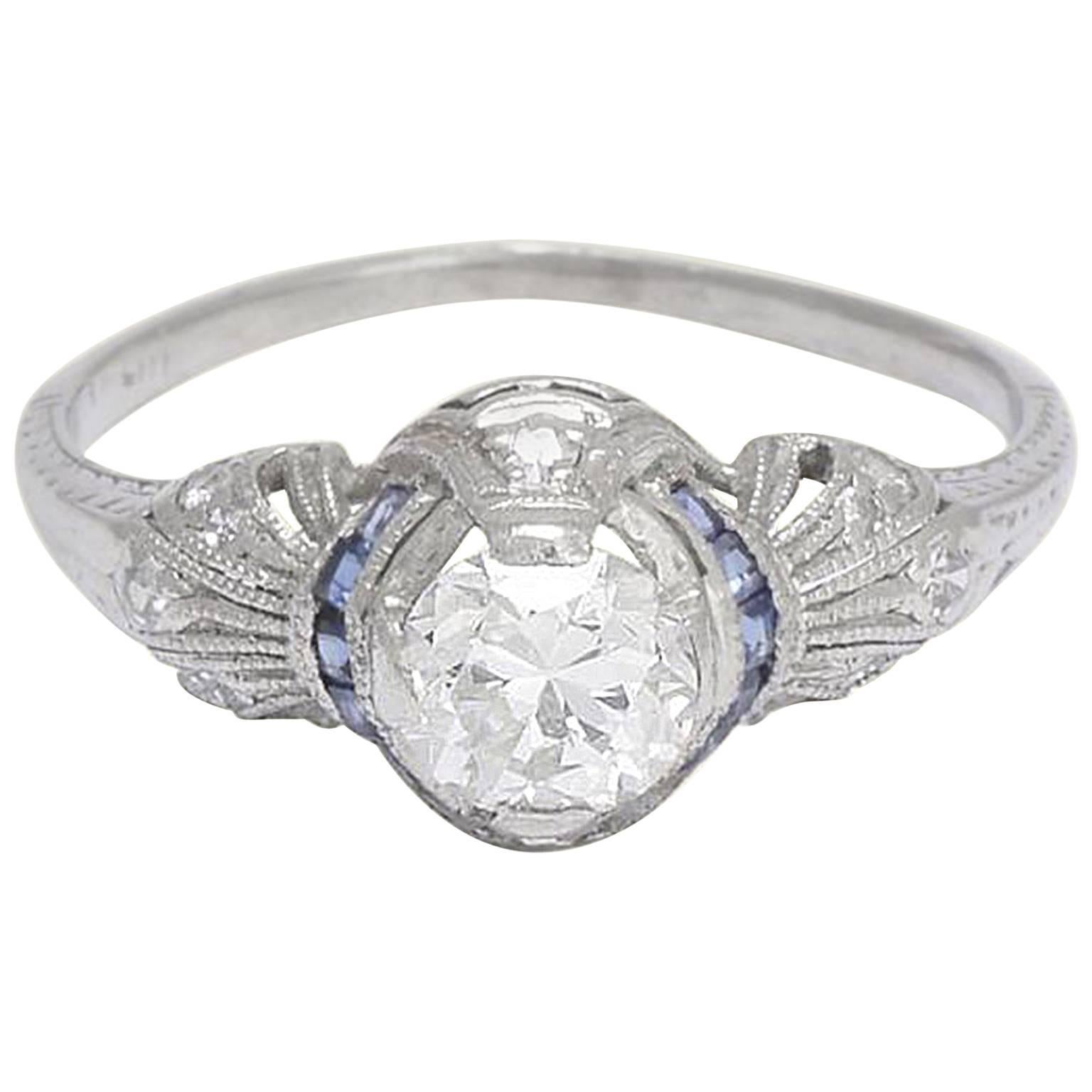 Art Deco Platinum .71 Carat Diamond Engagement Ring with Calibré Cut Sapphires For Sale