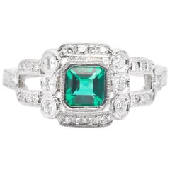 Vintage Hand Engraved Emerald and Diamond Ring in Luxurious Platinum