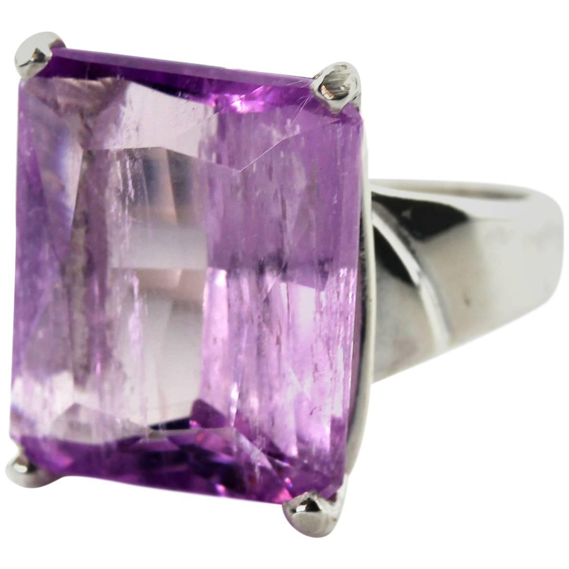 Splendid pink glittering translucent 15.98 Carat unique natural Kunzite from the mountains near Ouro Preto in Brazil.  The gemstone measures 14.4 mm x 17 mm and is set in a handmade Sterling Silver ring size 7 (sizable for free).  