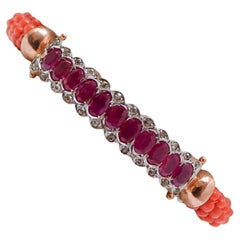 Bracelet en or rose, rubis, diamants et corail.
