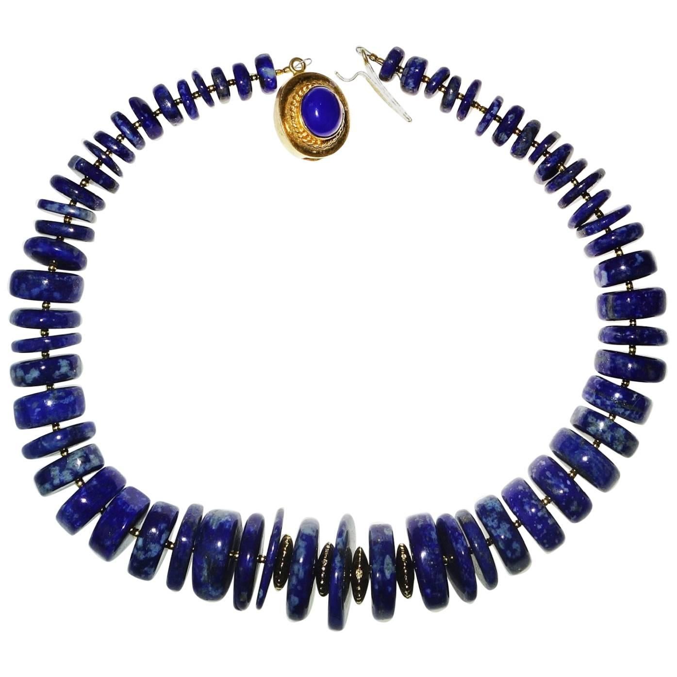 Custom made, spectacular 16 inch Choker of highly polished Lapis Lazuli rondelles with gold tone accents. The mixed widths of the Lapis Lazuli Rondelles accentuates the updated stylish look of this choker length necklace. Because these are large
