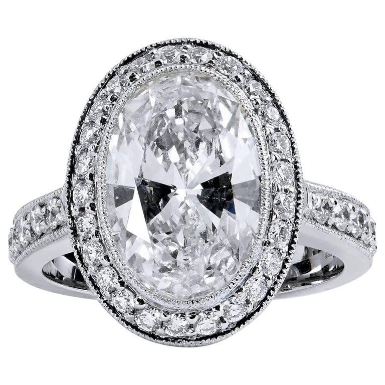 GIA Certified 3.18 Carat Oval Bezel Set Diamond and Pave Platinum