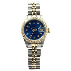 Rolex Lady Datejust 69173, 26 mm, esfera azul con diamantes, bisel con diamantes, oro amarillo y acero