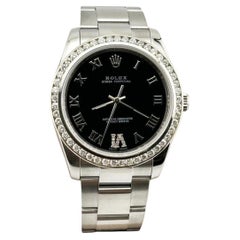 Rolex Oyster Perpetual 114200 34mm Black Roman Dial Diamond Bezel Steel