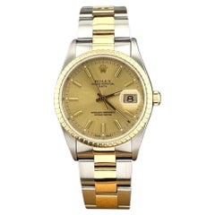 Rolex Date 15223 34mm Champagne Dial 18k Yellow Gold Steel Box Paper