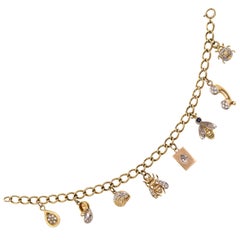 Adorable 14 Karat Yellow Gold and Diamond Charm Bracelet