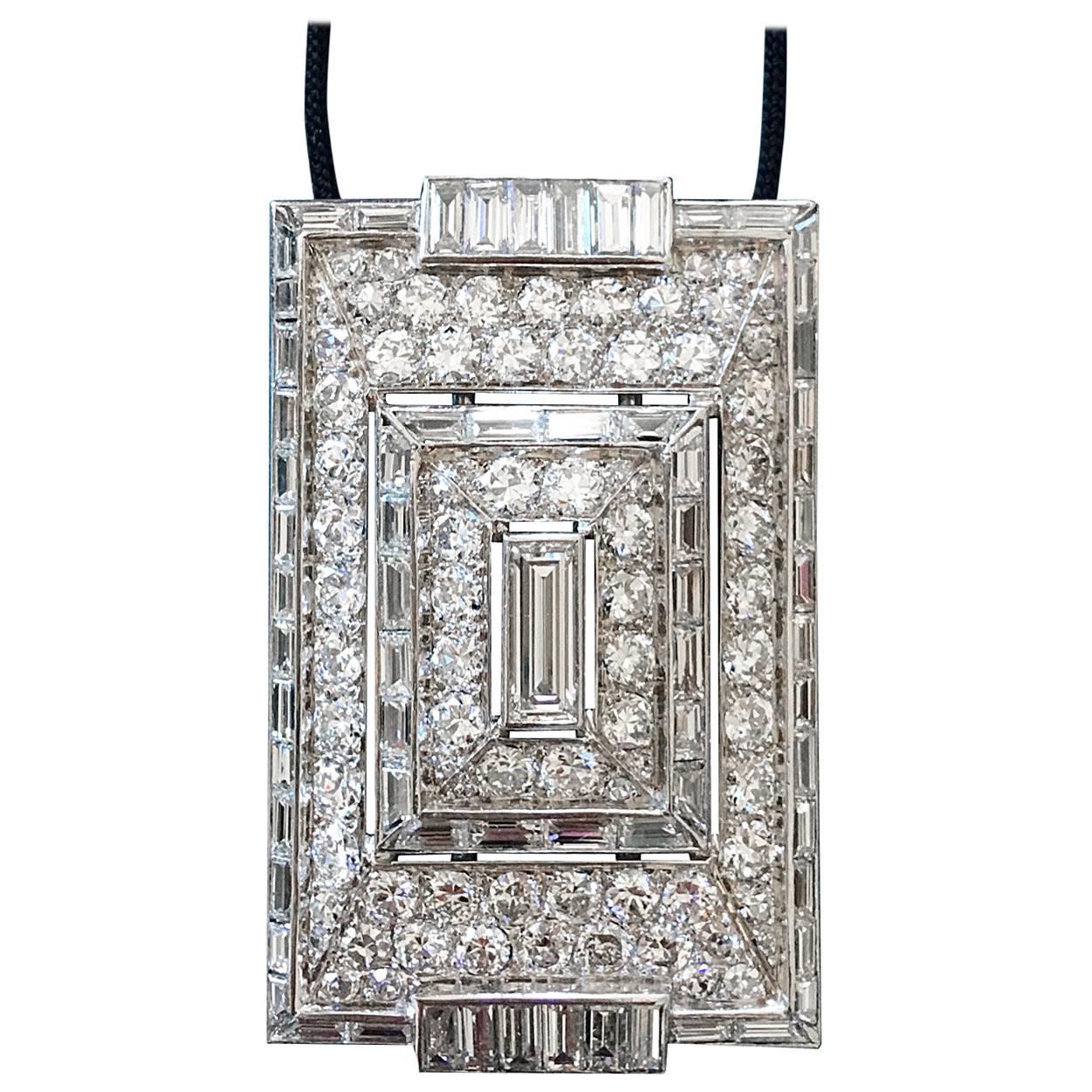 This piece is a wonderful creation of top quality. The modernist design of Art Deco period. Diamonds are white and clean Round and Baguette cuts perfectly matching. The clasp is also in Baguette cut Diamond.
The Pendant is convertible in