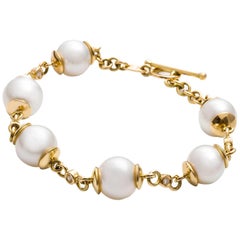 18 Carat Yellow Gold Pearl and Diamond Bracelet 7
