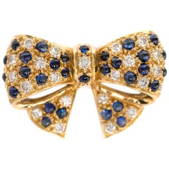 1950s Vintage 18 Karat Yellow Gold E.W&CO Brooch with Diamonds and Sapphires