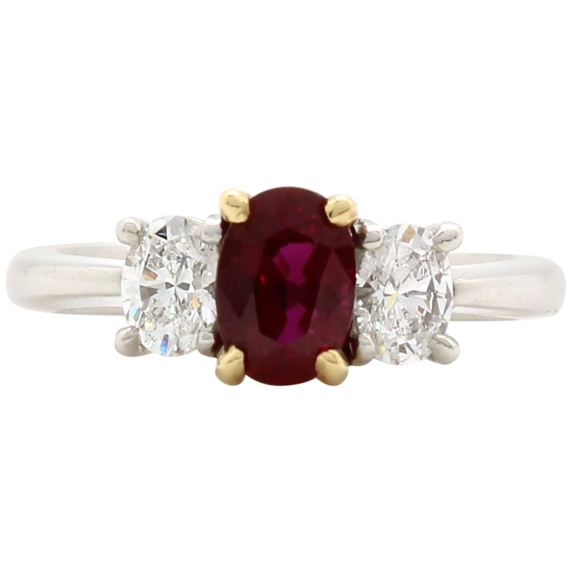 Vintage 1.08 Carat Oval Ruby and Diamond Three-Stone Ring For Sale