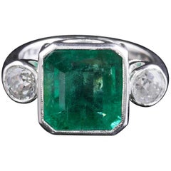 Art Deco Emerald Diamond Platinum Ring 8 Carat Emerald 1.20 Carat Diamond