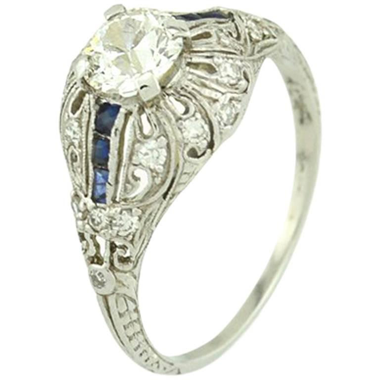 Art Deco 0.66 Carat Old Cut Diamond and Sapphire Platinum Engagement Ring For Sale