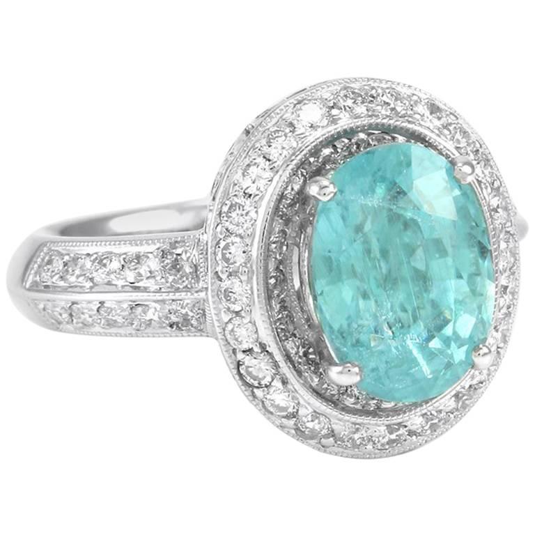 3.30 Carat Paraiba Tourmaline and Diamond Halo Ring in Gold For Sale