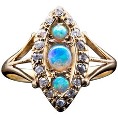 Opal and Diamond Trilogy Ring in 18 Karat Yellow Gold