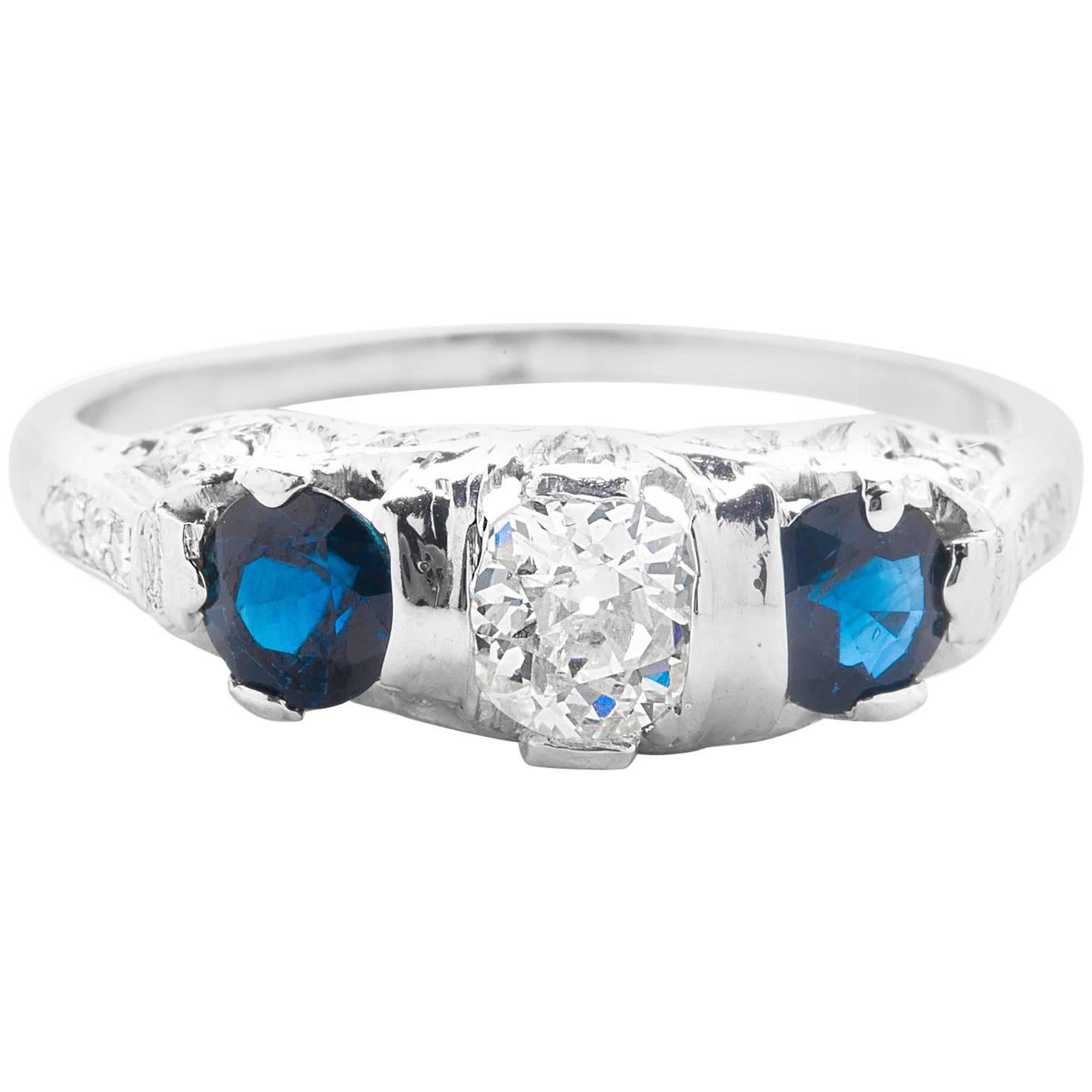 Art Deco Diamond and Sapphire Three-Stone Ring in Platinum For Sale