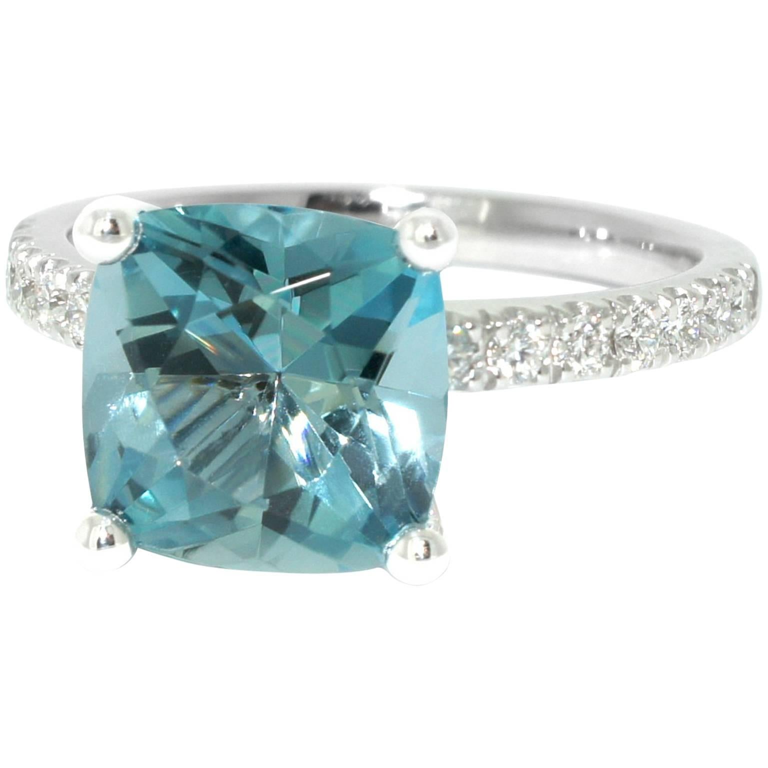 Set with a finest quality blue aquamarine, this solitaire engagement ring is elegant and timeless. Handmade in our Sydney studios in 18 karat white gold, this beautiful bridal ring sparkles with top quality diamonds set into the band. The setting is