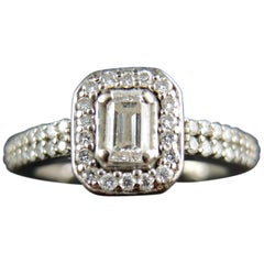  "Solitaire" Engagment Ring with Emerald's Cut Diamond 0.25 Carat