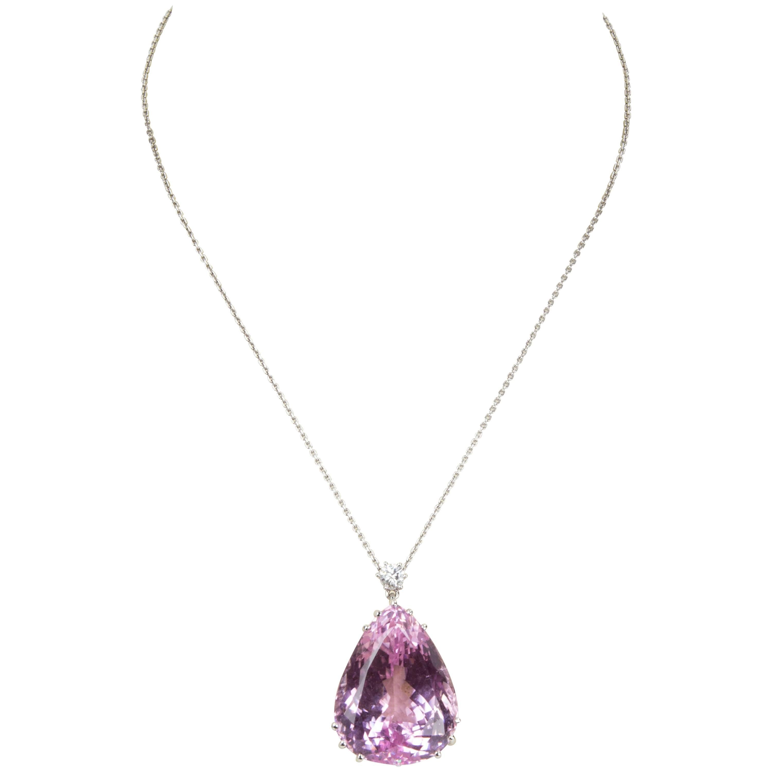 Sensational Pendant Necklace featuring a Teardrop faceted Pink Kunzite weighing approx. 130ct, and a Round Brilliant-cut Diamond, weighing approx. .65ct; hand crafted in 18k white gold mounting; suspended on an 18k white gold chain, approx. 18